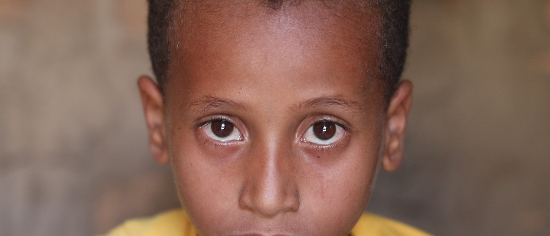 A portrait of Zaid, 9, in his home near Taiz, Yemen